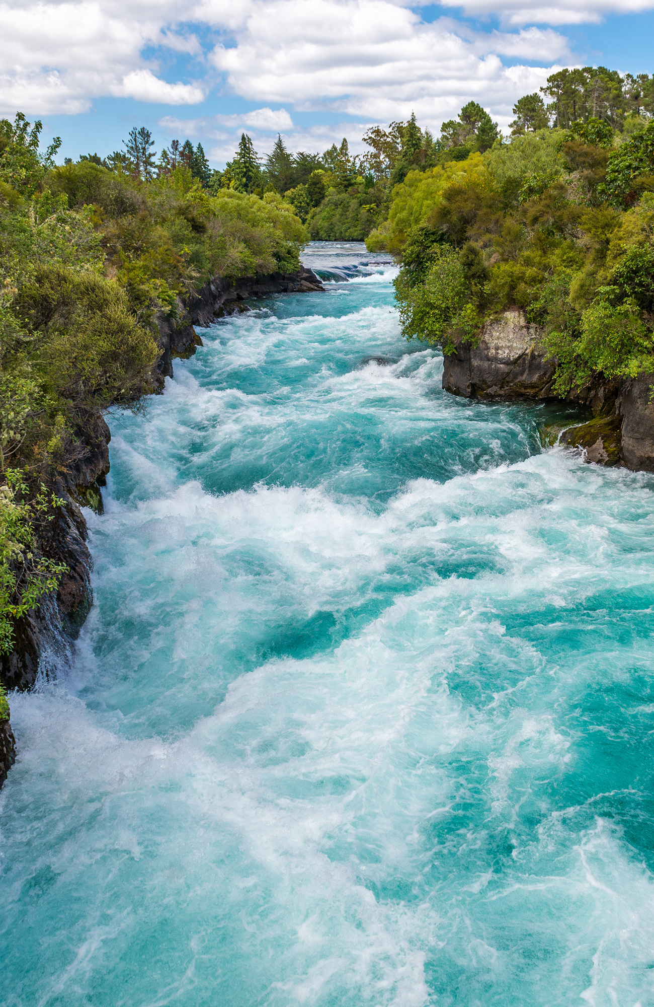 Image of a white water rafting route with rushing rapids in a beautiful setting - KILROY
