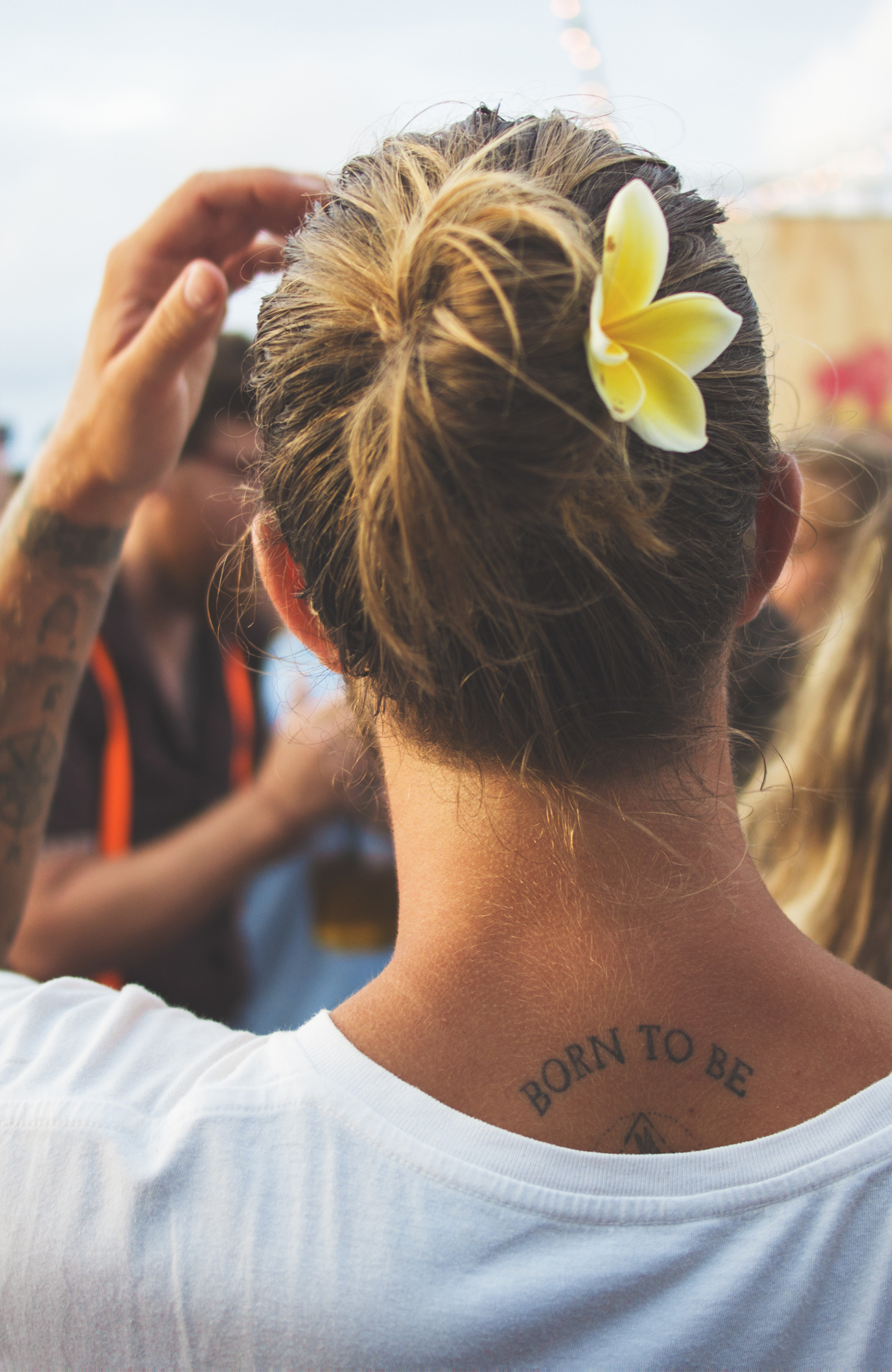 Image of a young traveller with a flower in his hair on the island of Bali in Indonesia - KILROY