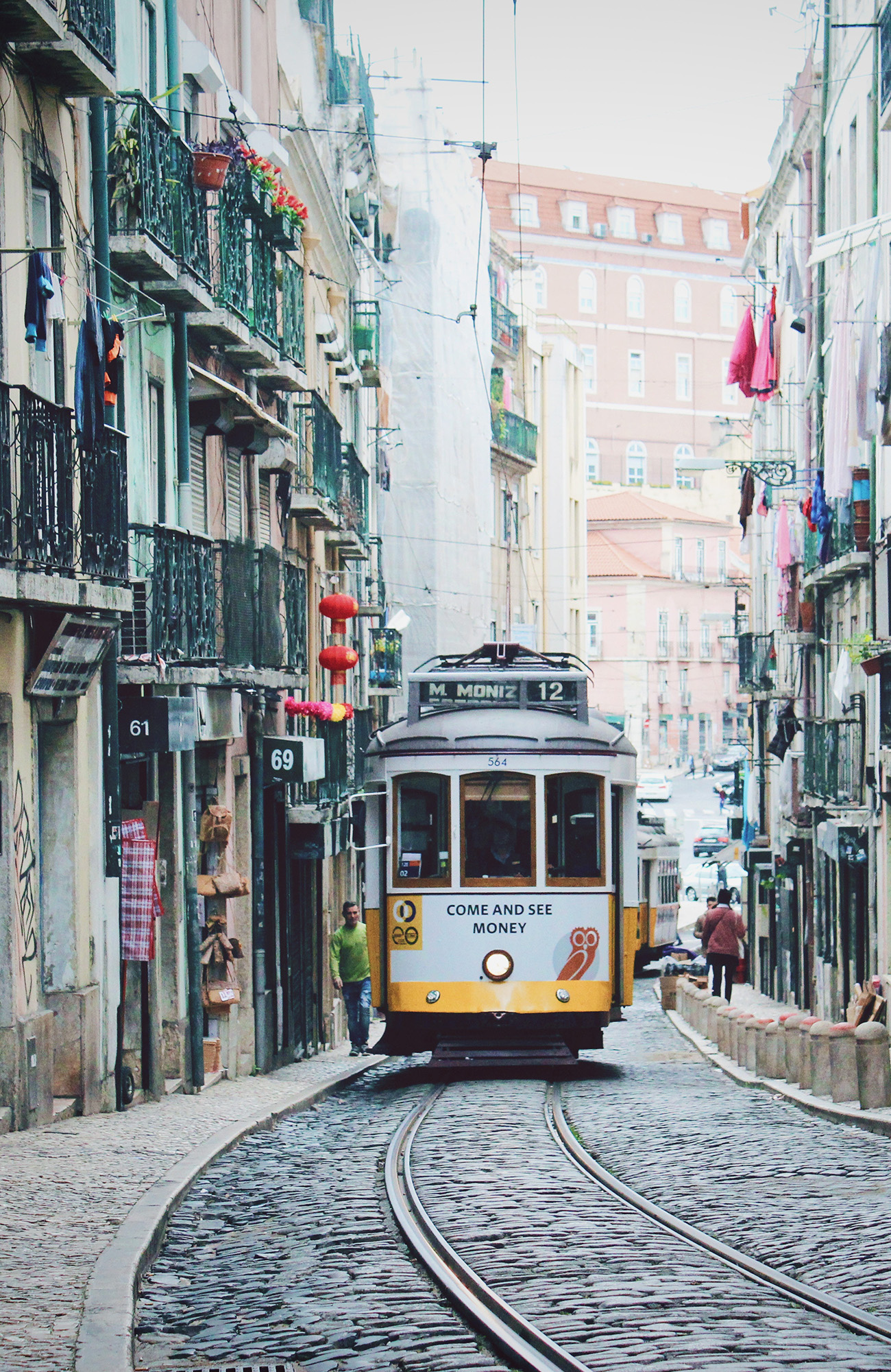 Image of a tram weaving its way through the streets of Lisbon in Portugal - KILROY