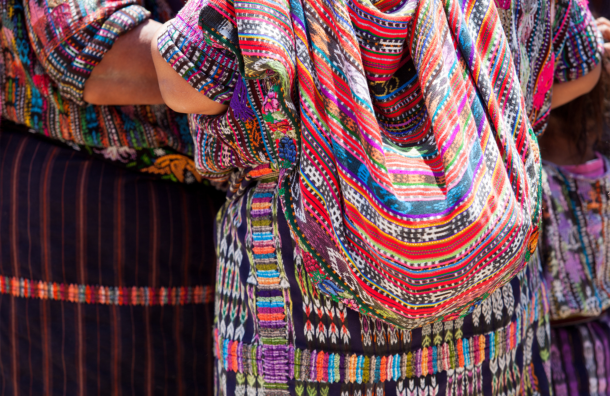 Close-up image of women wearing colourful traditional dress in Guatemala - KILROY