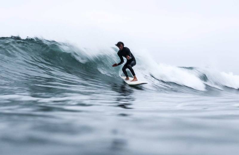 surfing-general-guy-takes-wave-ocean-cover