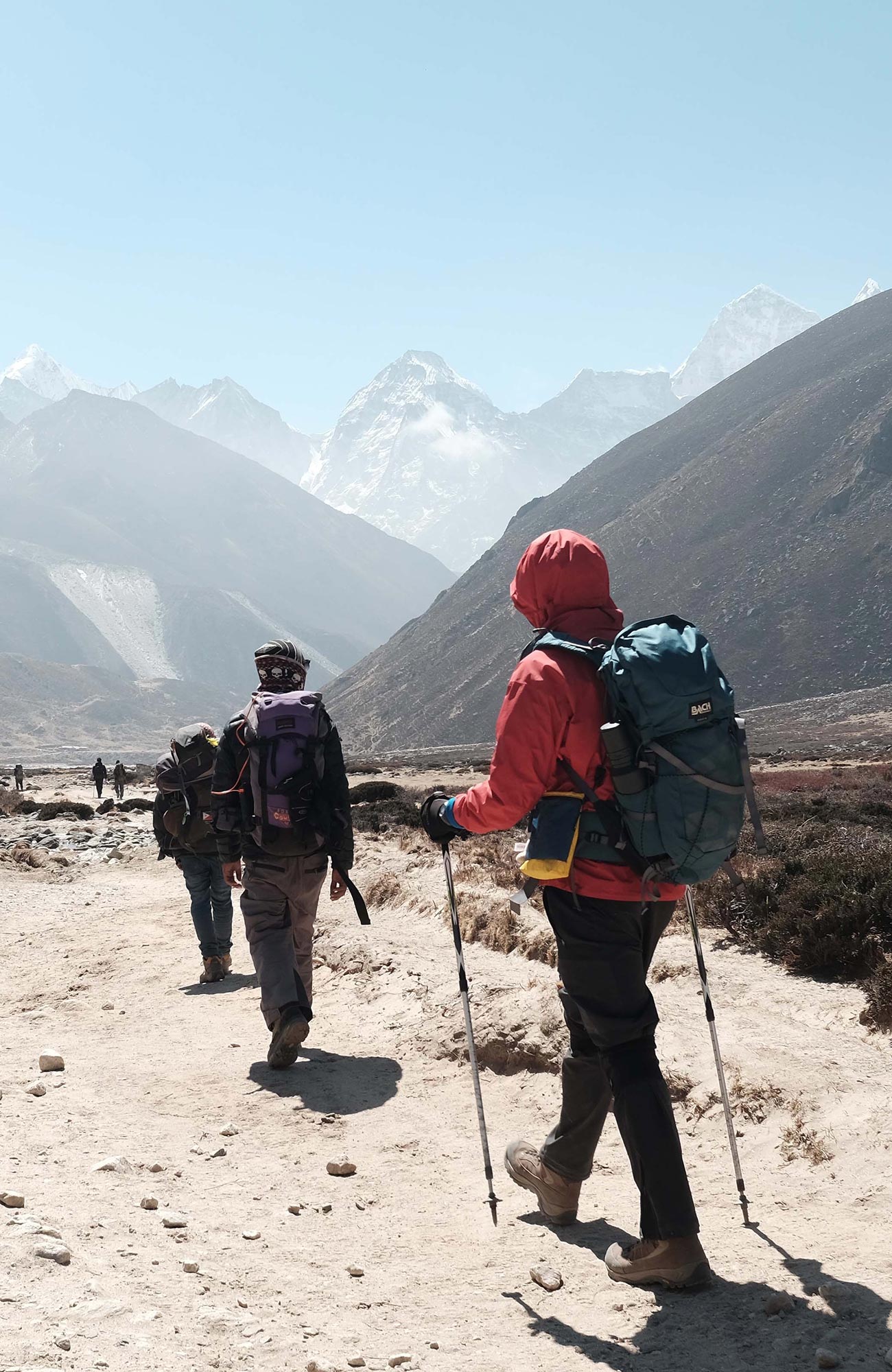 Image of hikers walking a mountain path in Nepal - KILROY