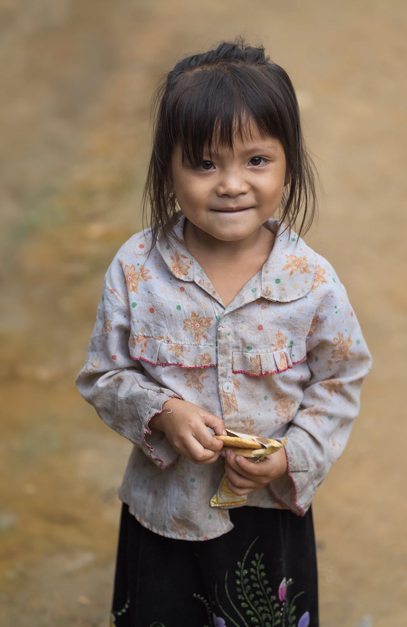 Image of a smiling young girl in Cambodia - KILROY