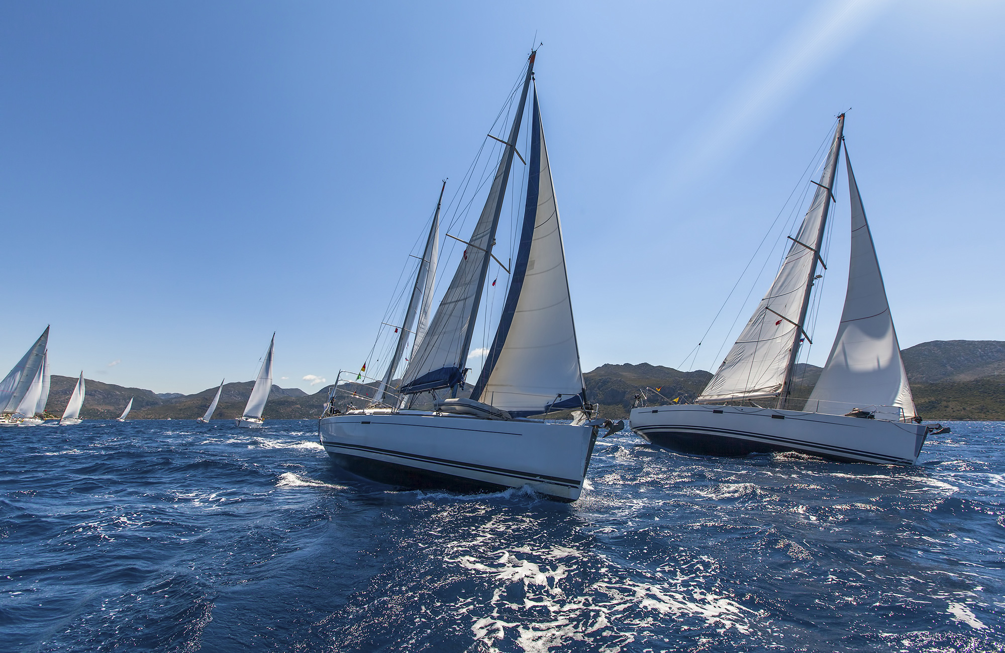 Image of sailing boats on choppy waters in Europe - KILROY