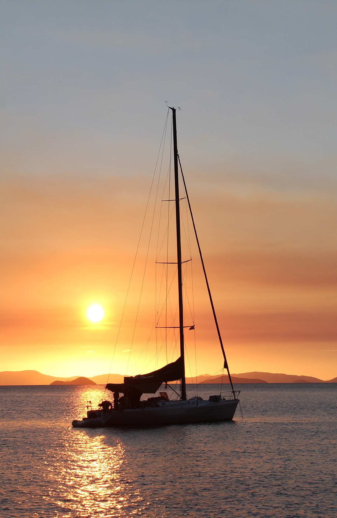 Image of a sail boat at sunset - KILROY