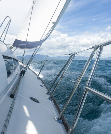 Image from a sailing boat as it cruises across choppy waters - KILROY
