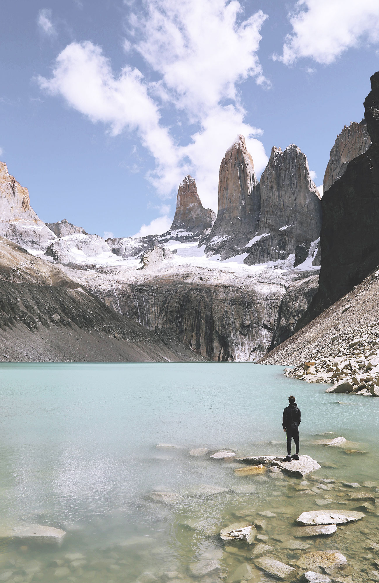 Image of a traveller admiring the famous Torres del Paine in Chilean Patagonia - KILROY