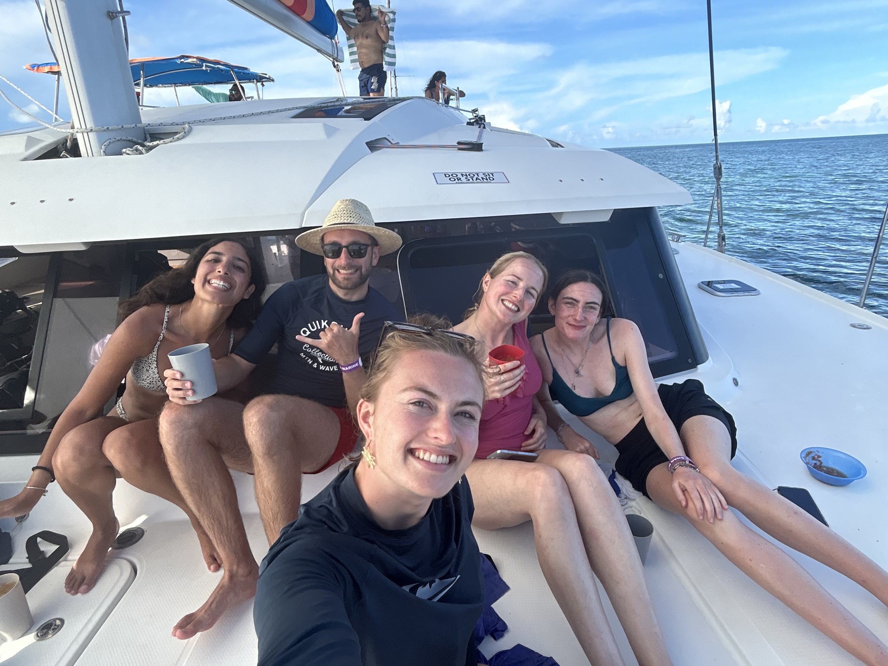 Image of a group of travellers on a boat in Belize - KILROY