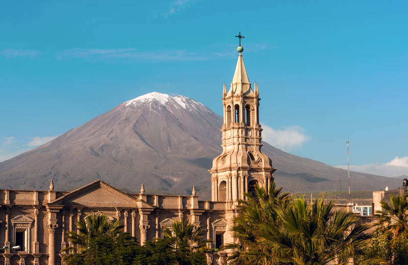 Church in the city of Arequipa with mountain in the background in Peru