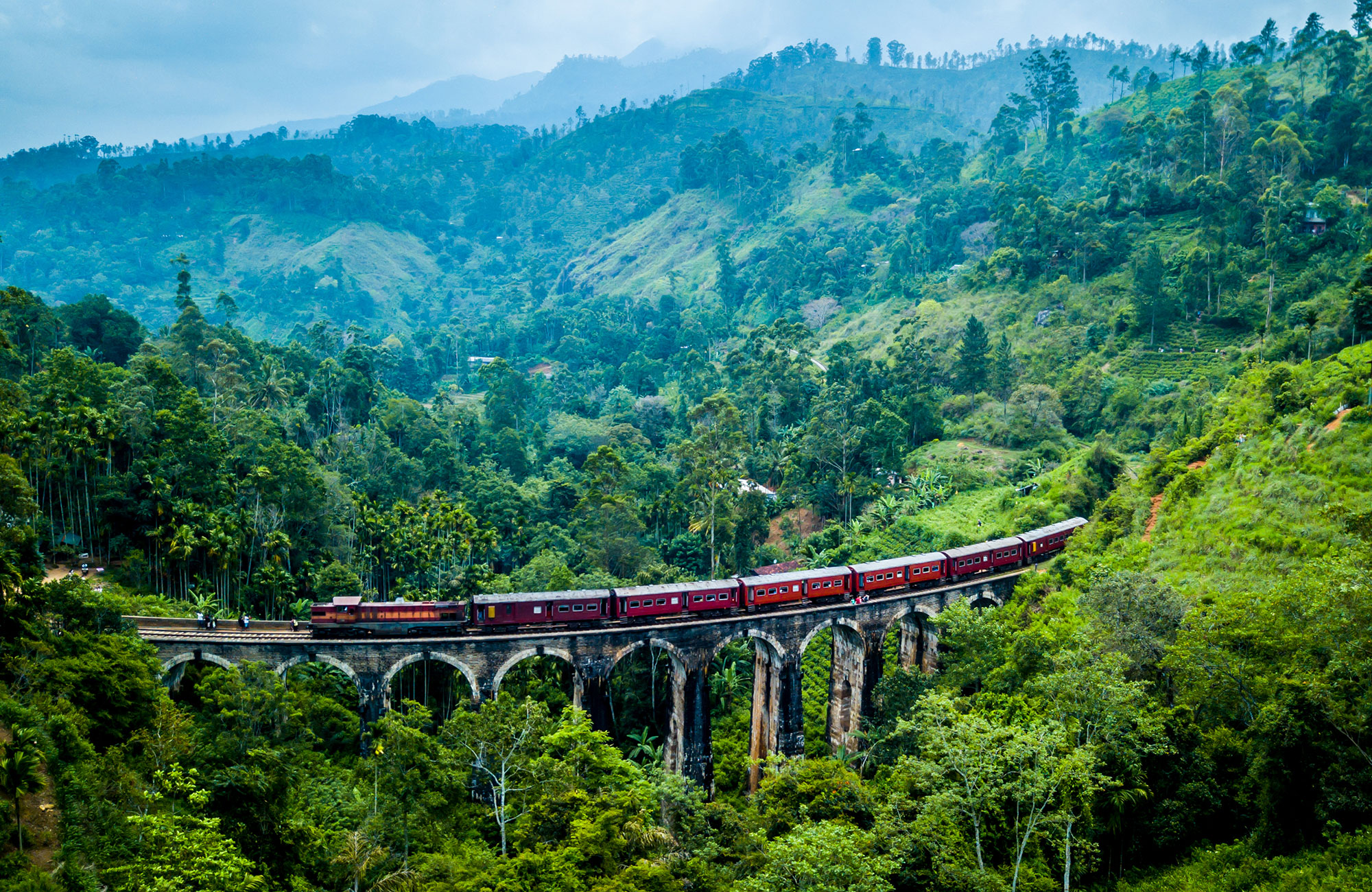 Image of a train crossing a bridge somewhere in Asia - KILROY