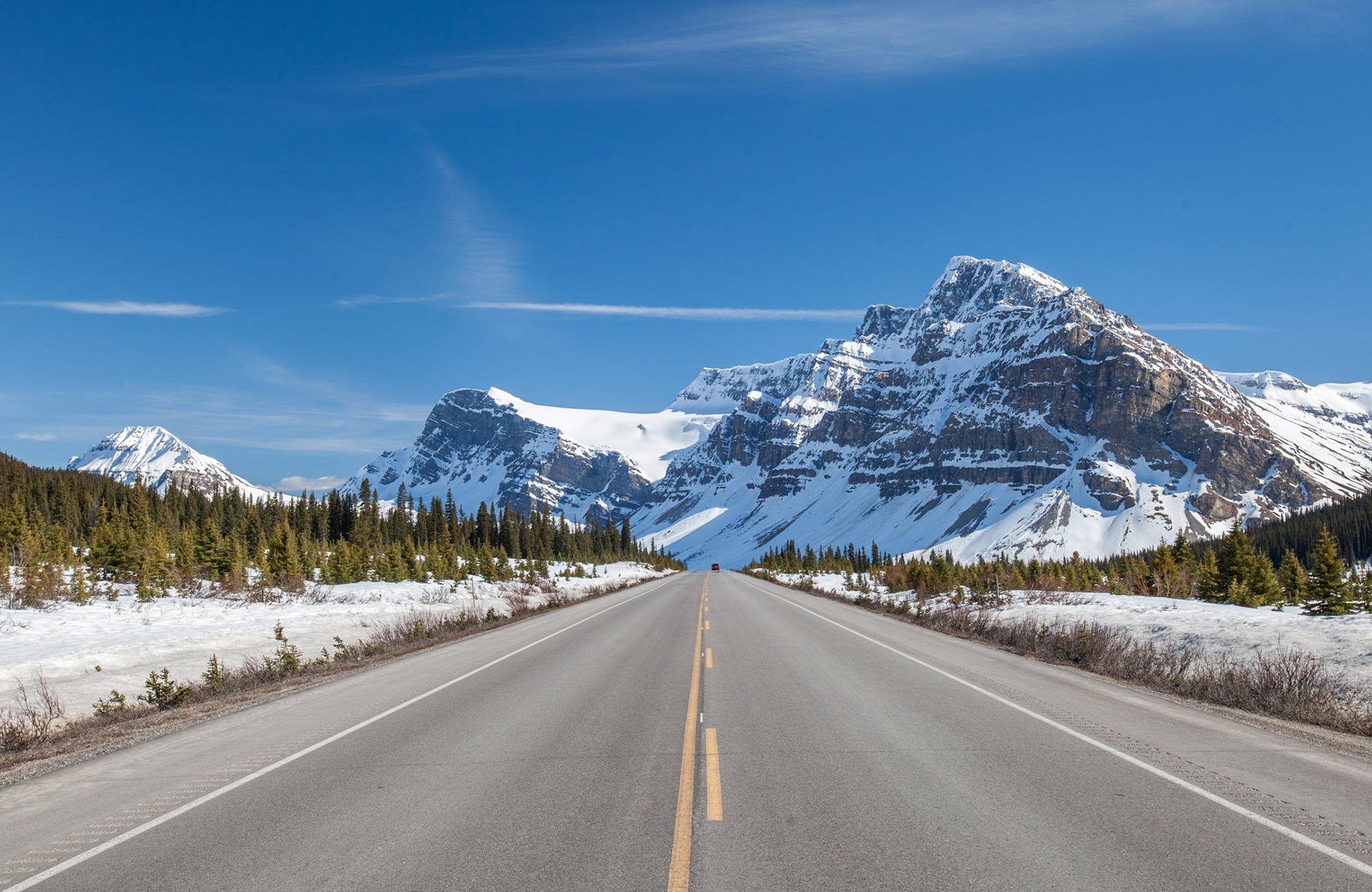 Image of a highway through a snowy mountain landscape in America - KILROY