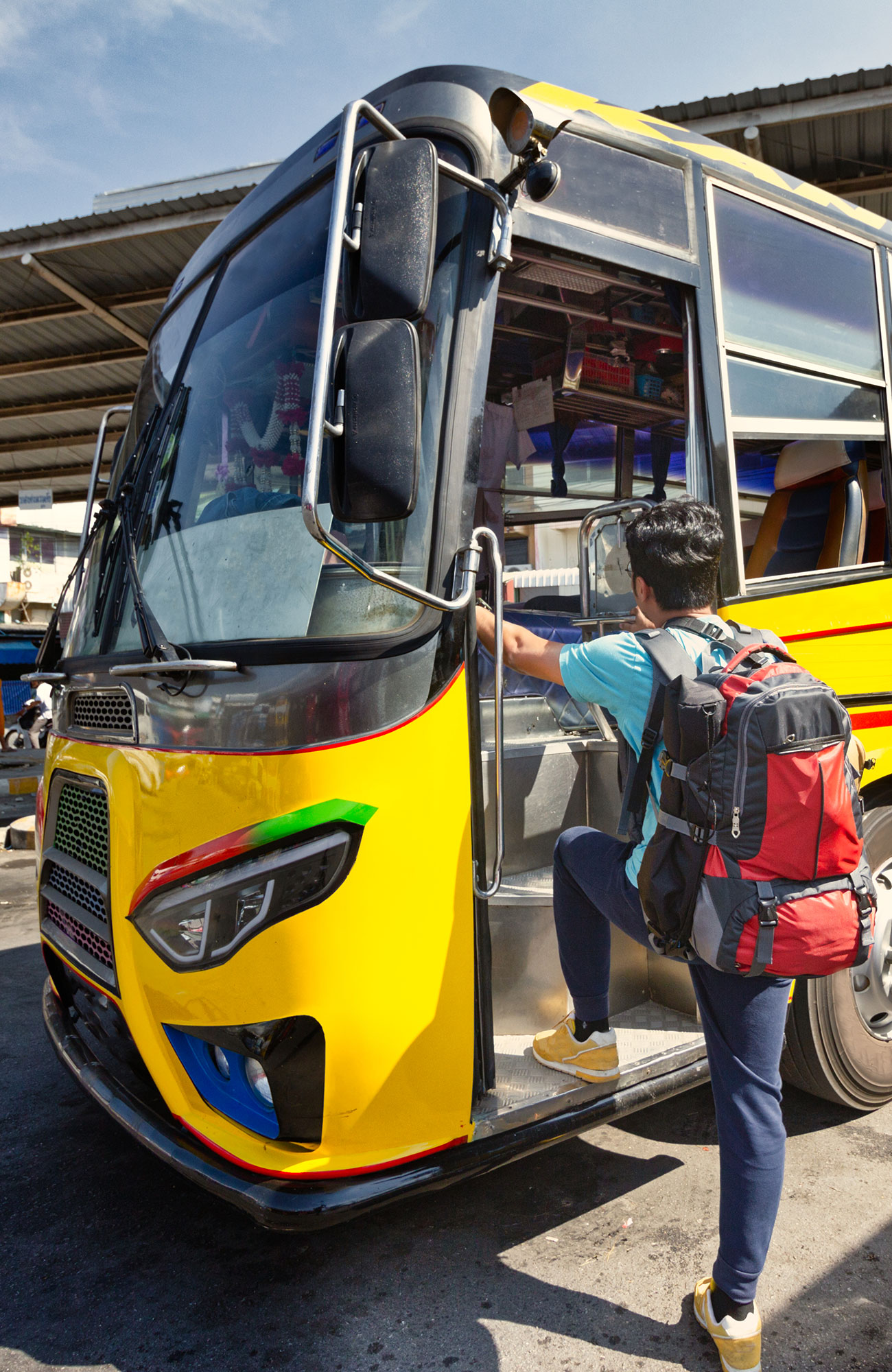 Image of a traveller boarding a bus - KILROY