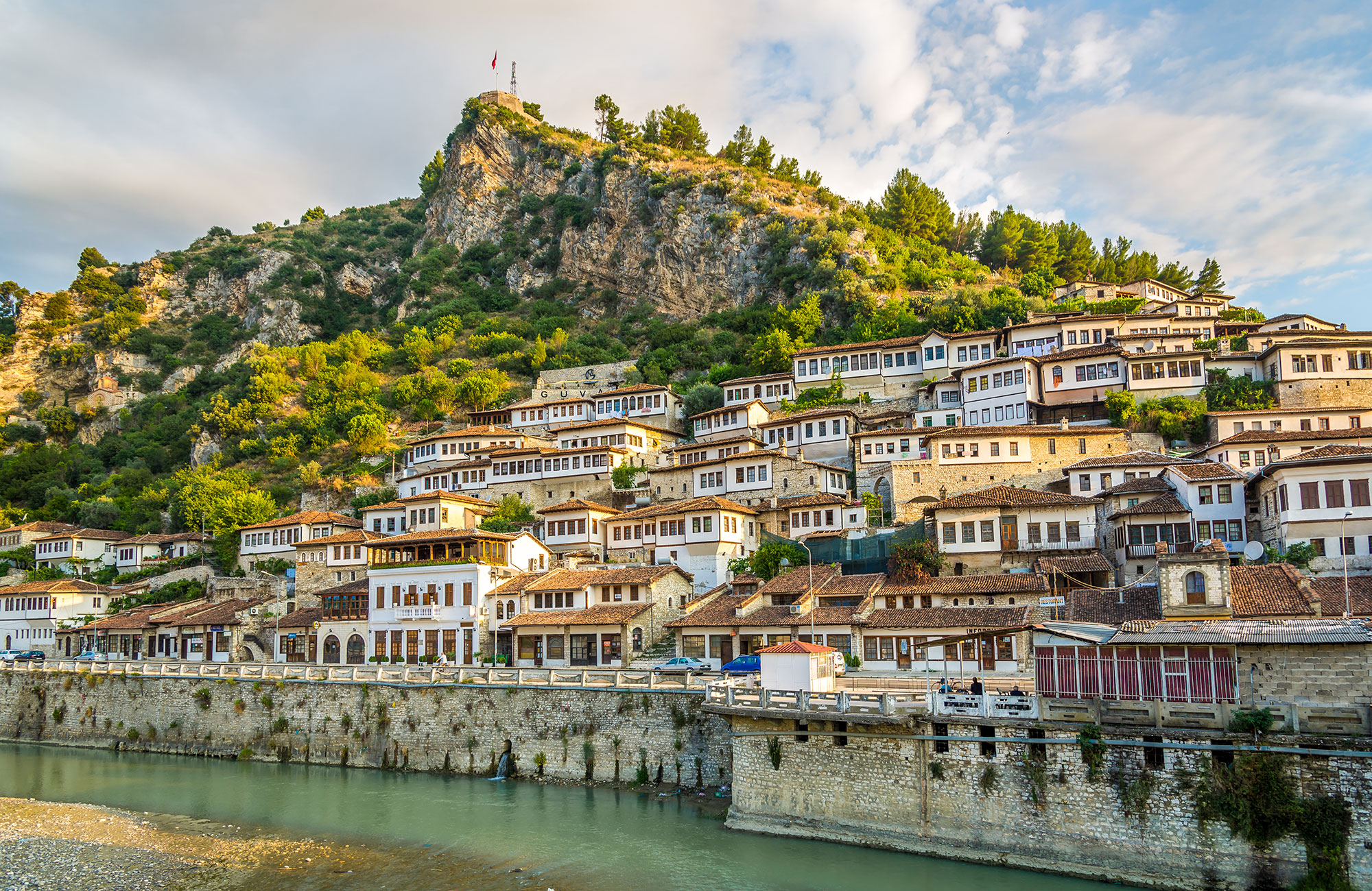 Image of a riverside town in Albania - KILROY