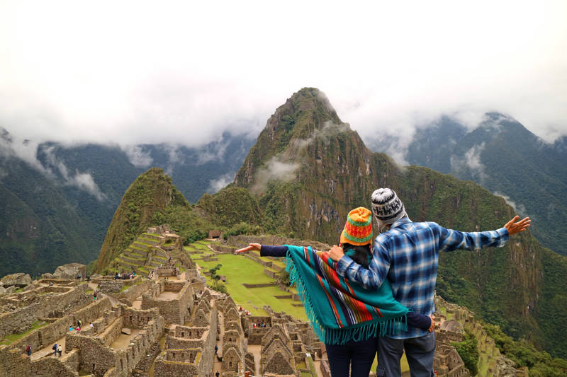 Image of a couple posing in front of Machu Picchu in Peru - KILROY