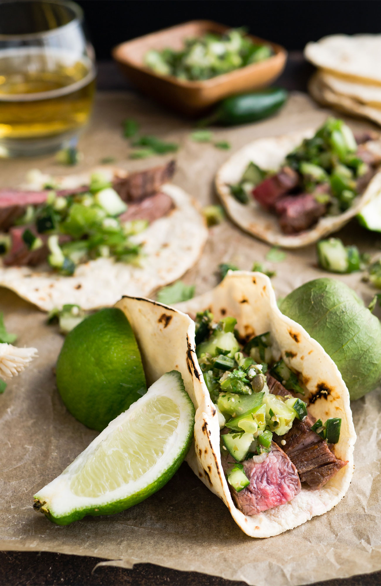 Image of traditional Mexican cuisine of beef tacos with wedges of lime - KILROY