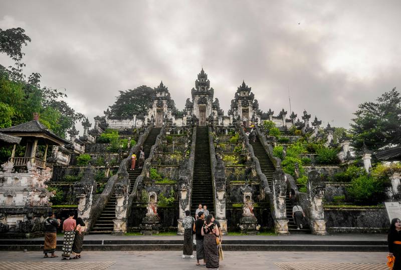 The famous Pura Lempuyang in Bali against dramatic grey clouds - KILROY