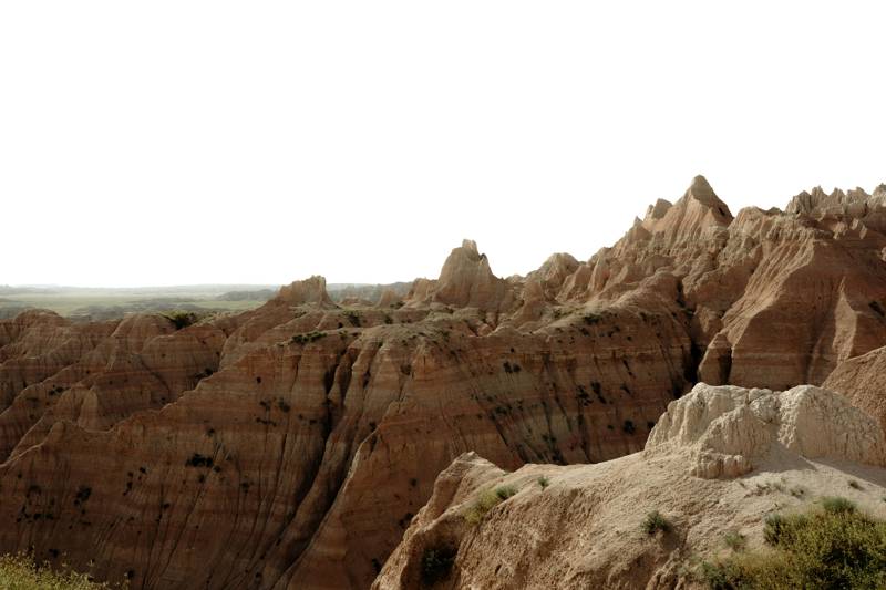 Jagged peaks of the badlands against a grey sky