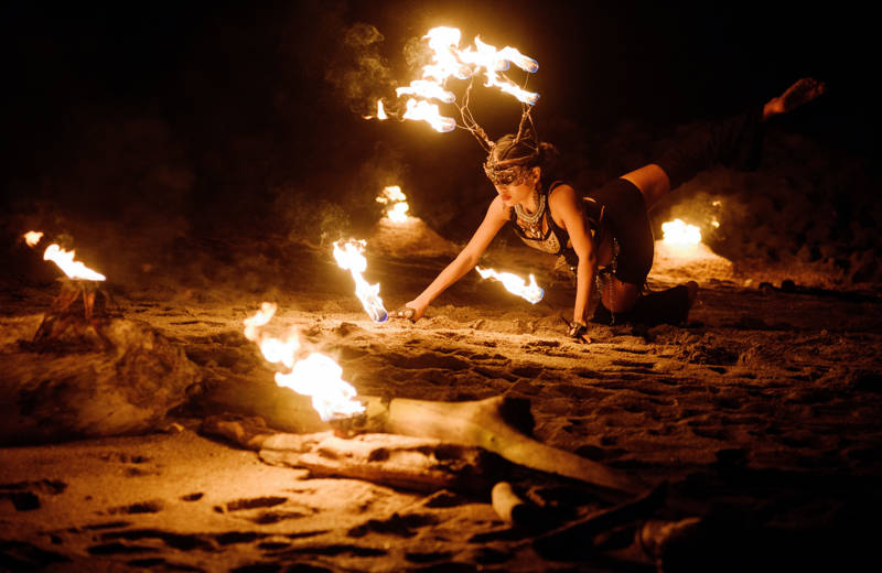 Woman fire dancing on a beach in Tamarindo in Costa Rica