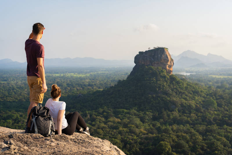 Image of a couple looking out towards Sigiriya Rock Fortress in Sri Lanka - KILROY