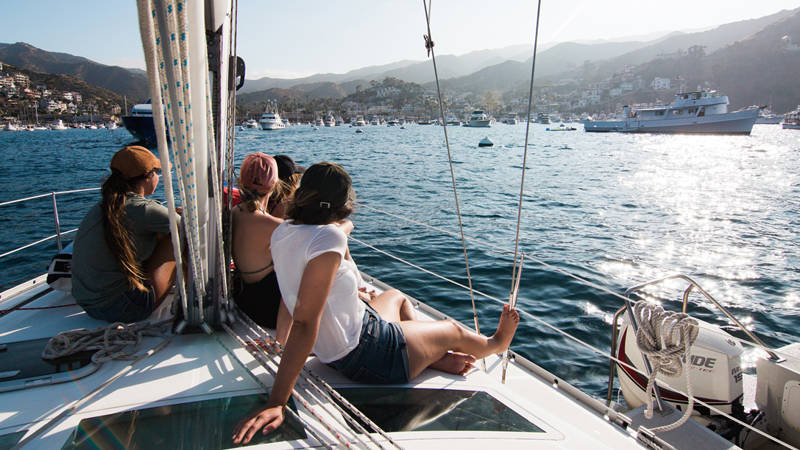 Image of group of travellers on a sailing boat - KILROY