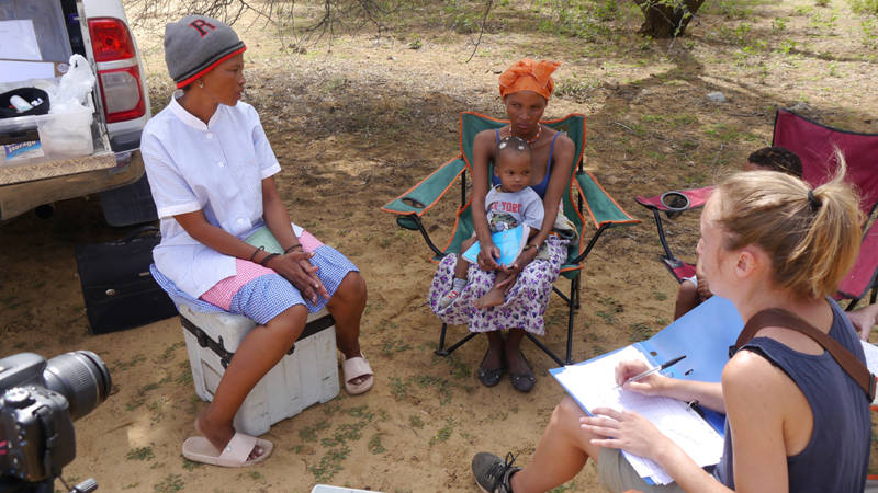 Image of a medical volunteer with community members in Namibia - KILROY