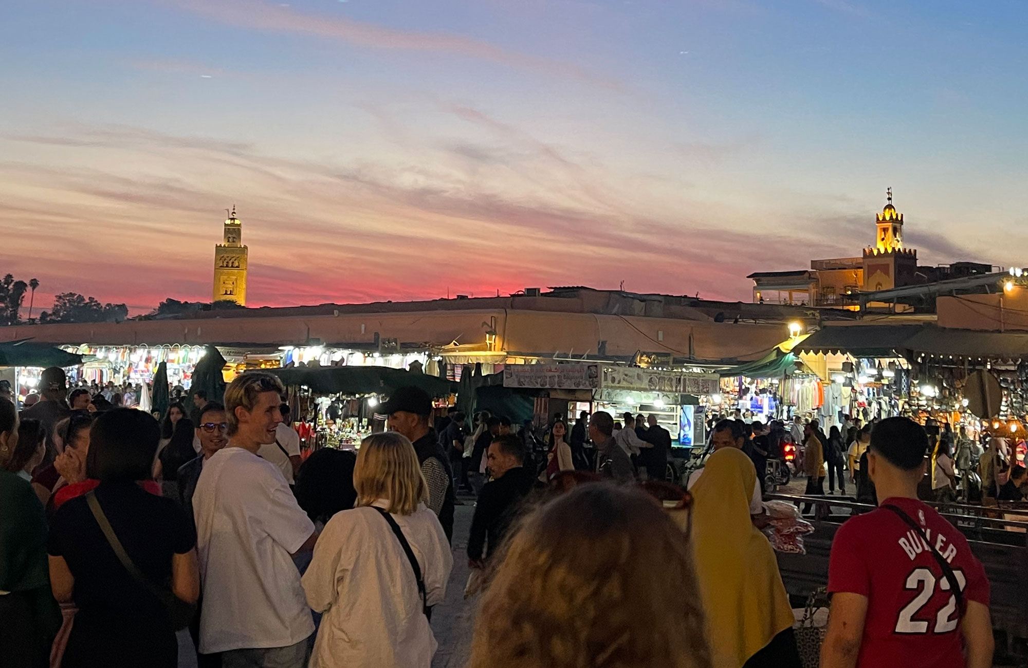 Image of a group of people at the main square of Marrakech in Morocco - KILROY