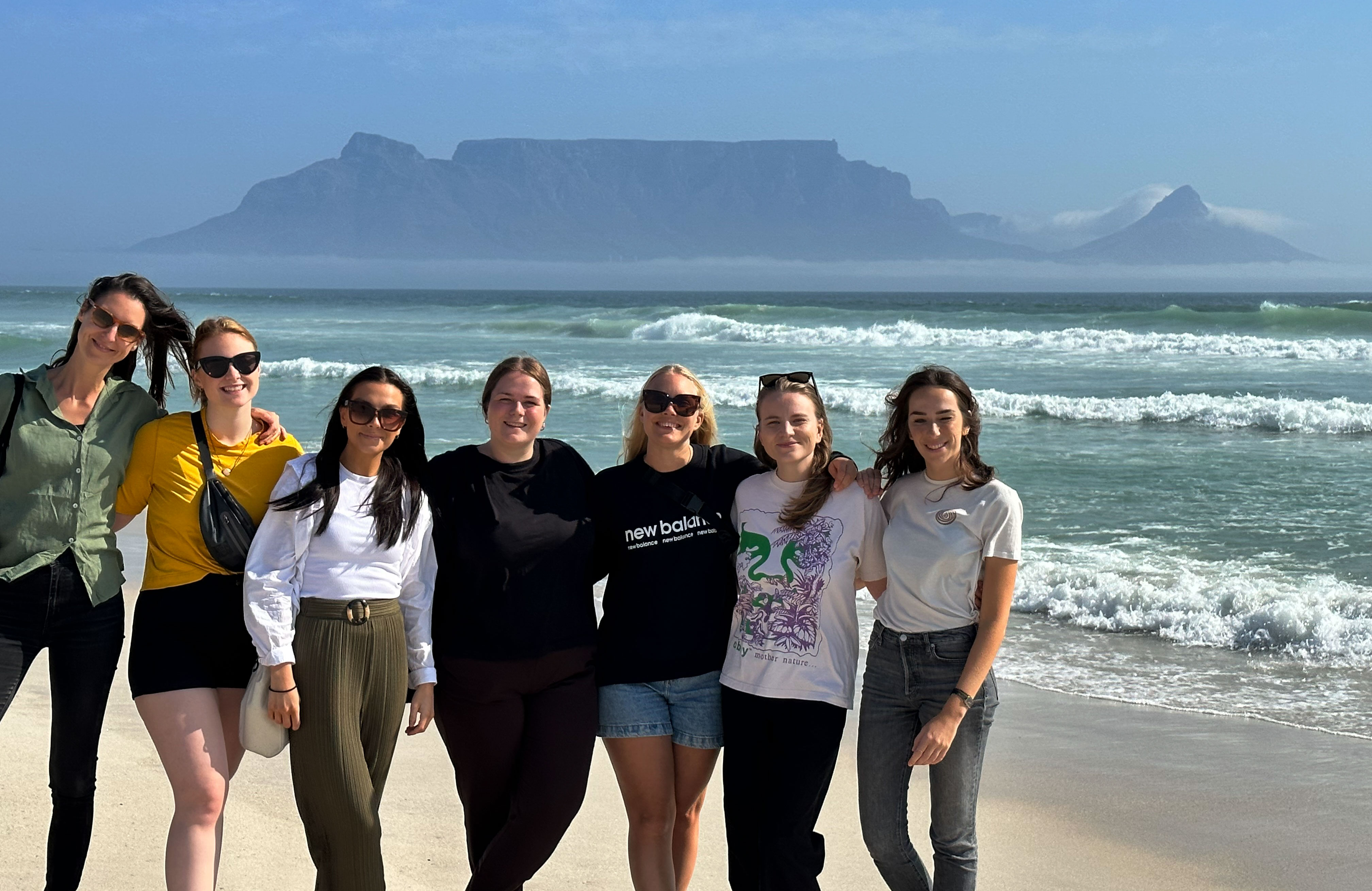 Group of KILROY staff in front of Table Mountain in Cape Town, South Africa