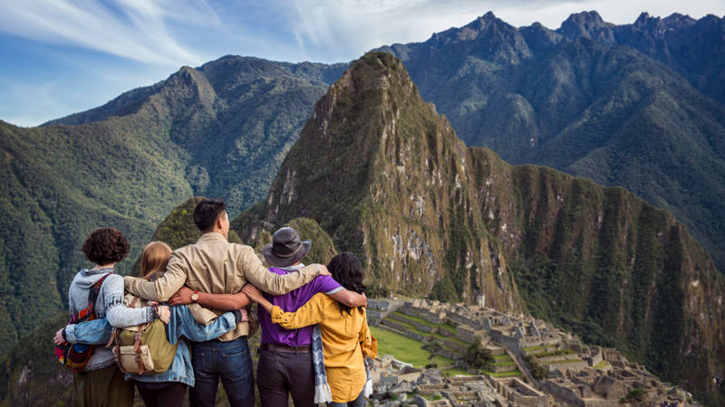 Image of a G Adventures tour group looking at Machu Picchu in Peru - KILROY