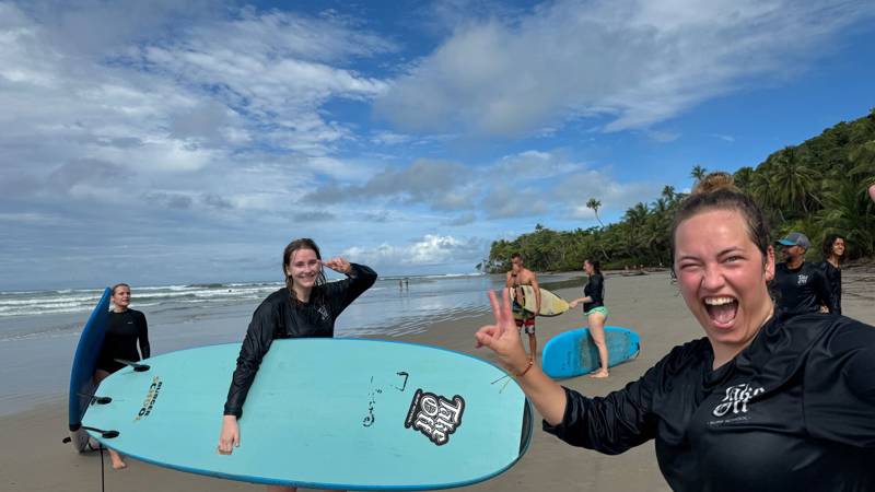 Image of a group learning to surf on a beach in Costa Rica - KILROY