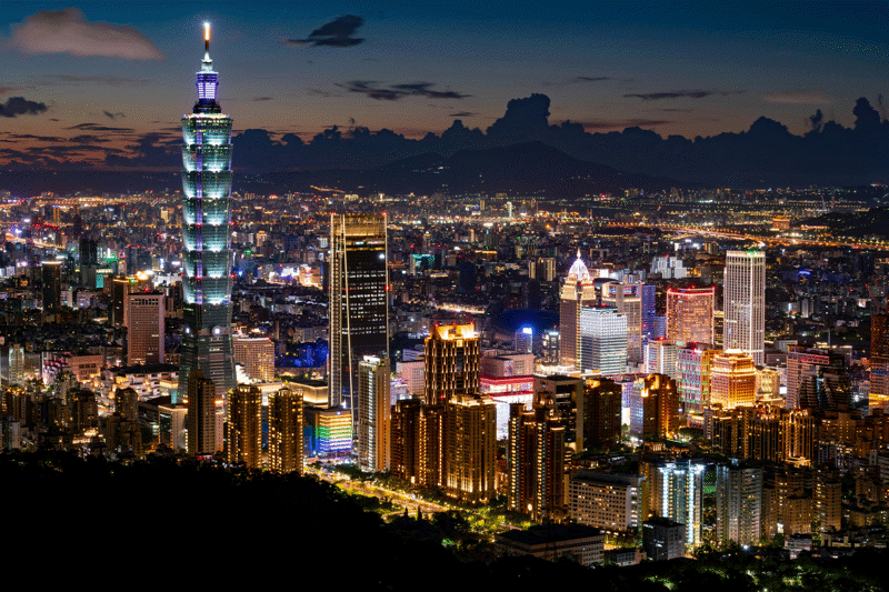Skyline of the city of Taipei at night, filled with colourful lights