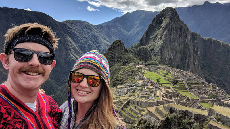 Image of a couple posing in front of Machu Picchu in Peru - KILROY
