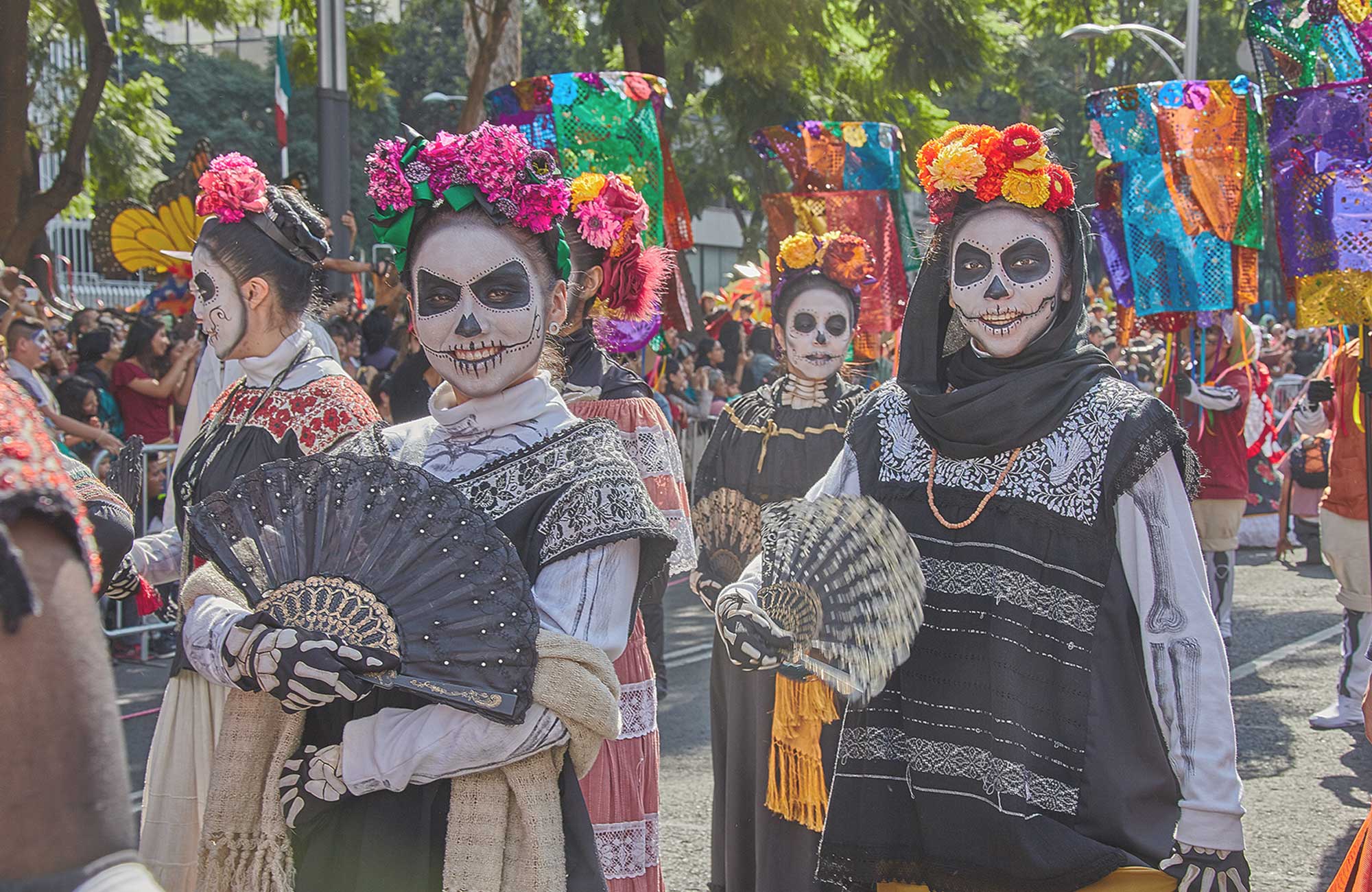 Image of a woman at a Dia de los Muertos in Mexico - KILROY