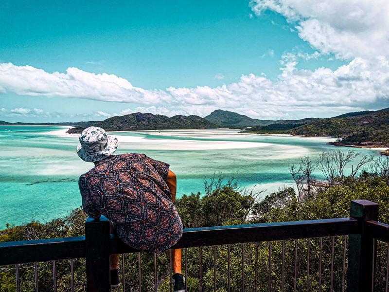 Image of a male traveller viewing the Whitsundays from a view point - KILROY