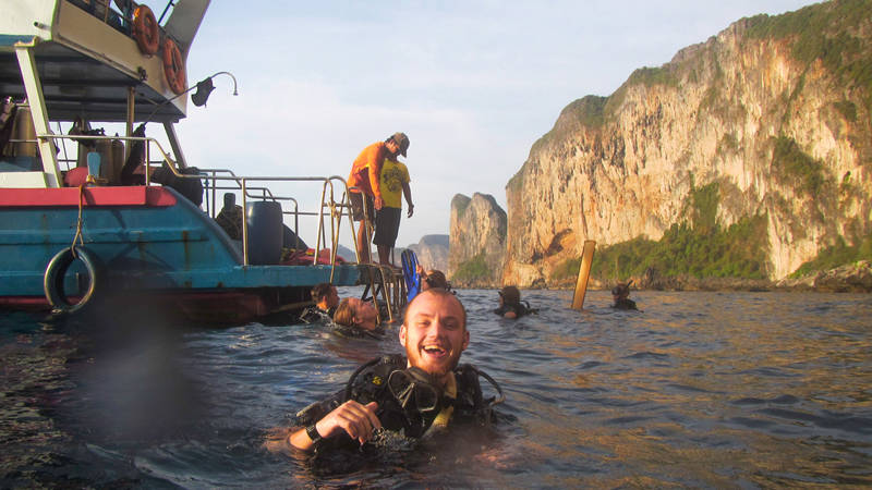 Image of a man diving near Koh Phi Phi in Thailand - KILROY