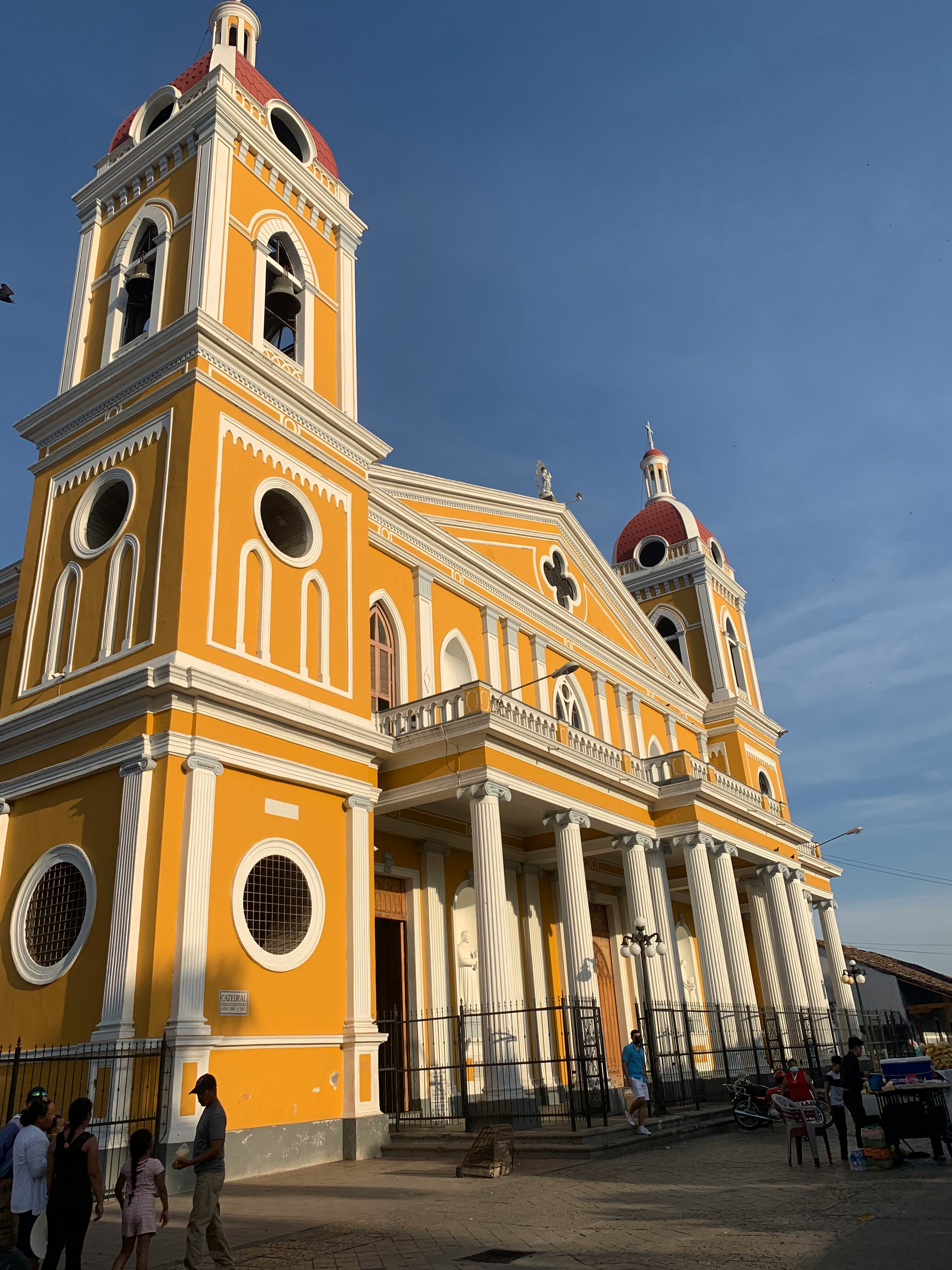 Image of a brightly coloured church in the city of Granada in Nicaragua - KILROY