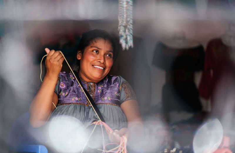 Friendly local woman smilling at a market in Central America