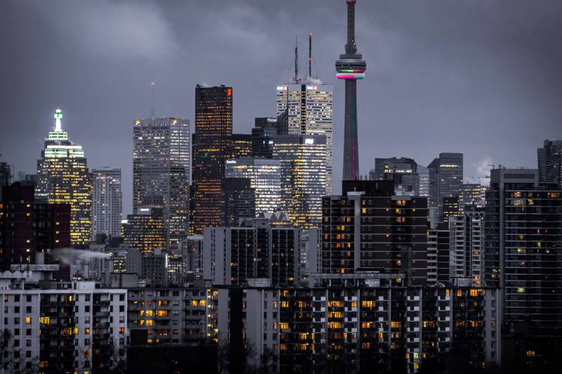 Skyline of the city of Toronto in Canada during the evening, with lots of lights in the skyscrapers